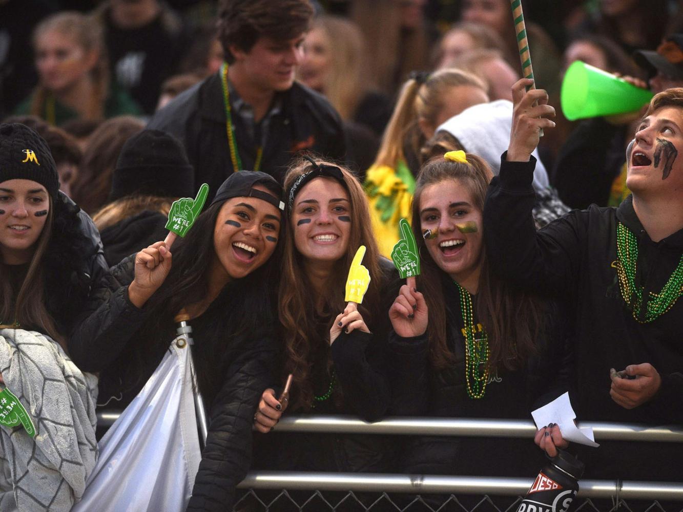 Manogue senior girls cheer on the football team during the September 22 game versus Reed. Photo courtesy of the Reno-Gazette Journal.