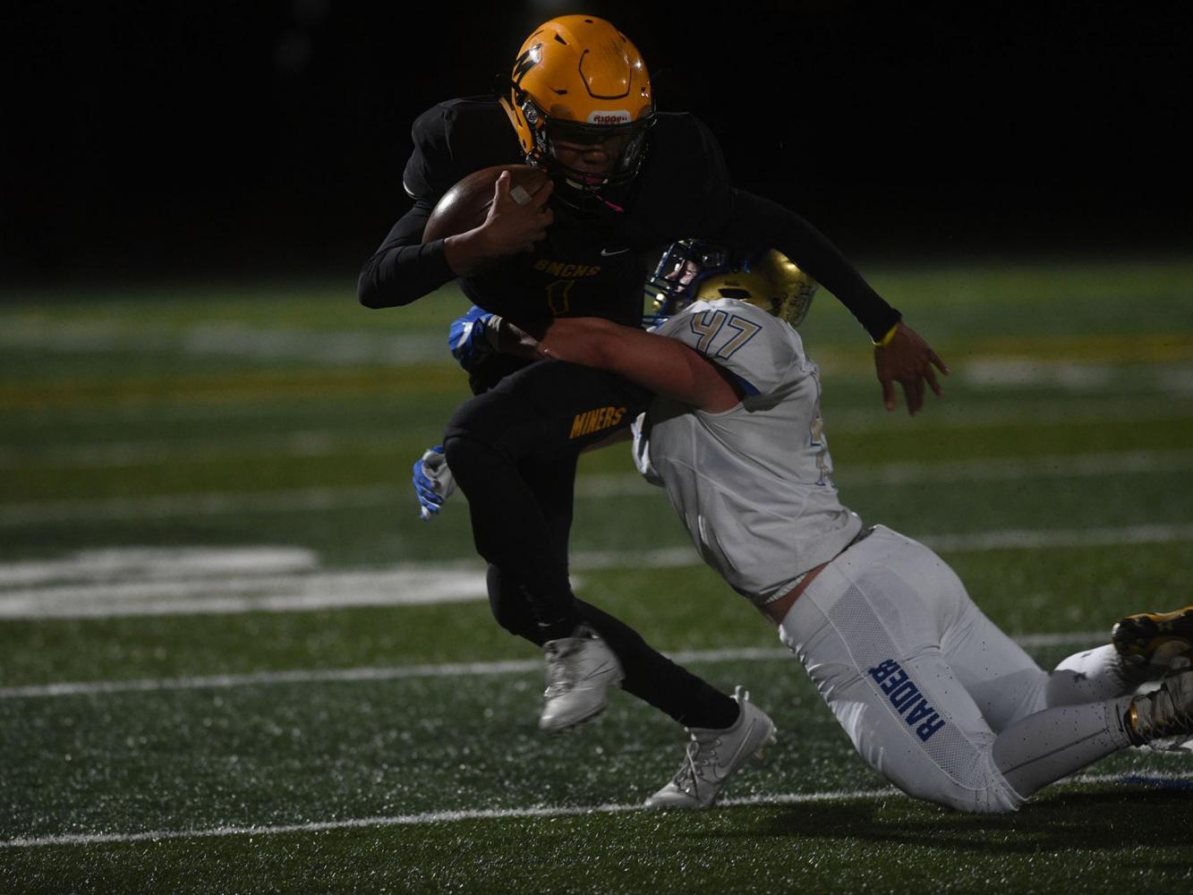 Josh Rolling makes a run for it, fighting back against the Reed Raiders on September 22. (Photo courtesy of the Reno Gazette-Journal)
