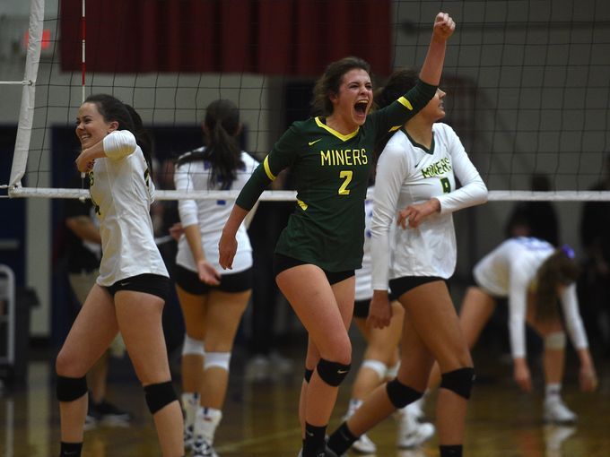 Taylor deProsse (senior Libero) cheers as her team scores a point against the Huskies during the first set.