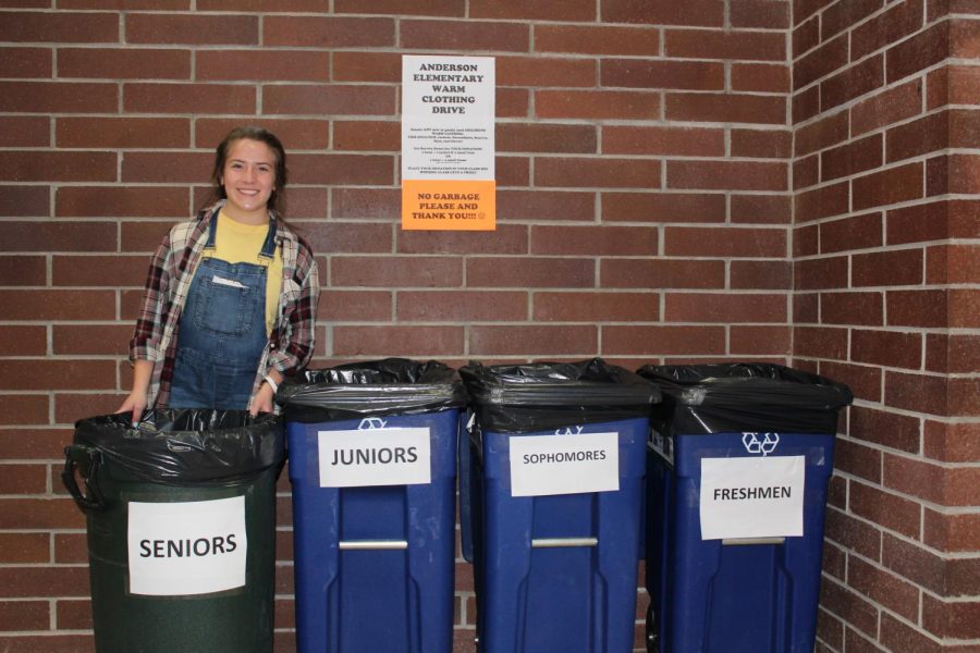Valentina Ossio-Marin, President of the Interact Club, pictured next to the drop-off bins outside the Chapel. (Photo Courtesy of Miner Detail Staff)
