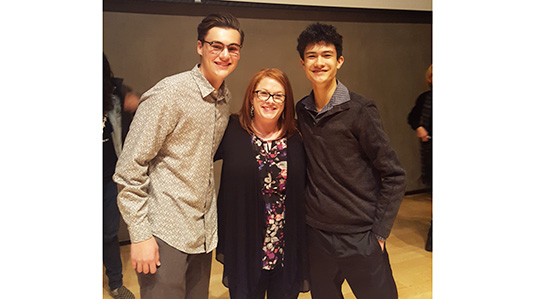 Tyler Rahimzadeh (left) and Mickey Kerr (right), with their Honors English 11 teacher Katie LaPointe (middle).