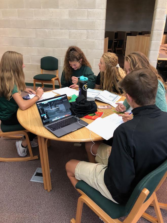 AP students hard at work on their homework in the Knowledge Center. Photo courtesy of the yearbook committee. 