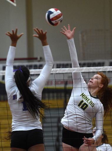 Senior Emma Pence (middle blocker) goes up for a swing during last years Reno match.  (Photo courtesy of RGJ.)