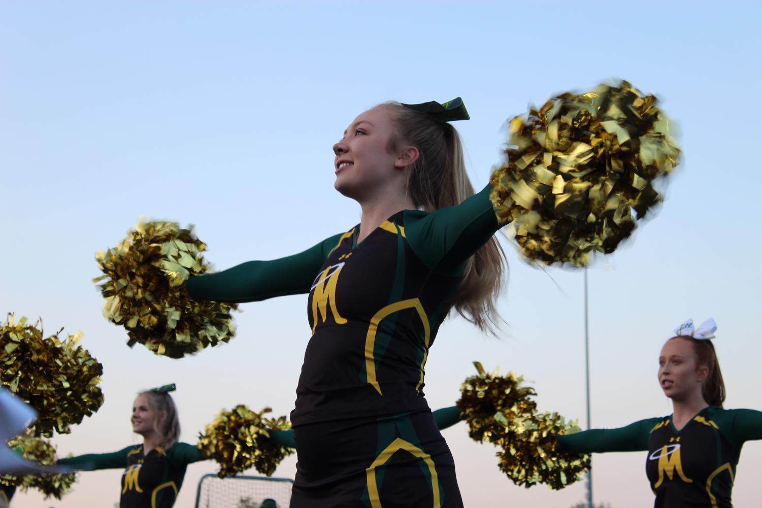 Hannah Shultz, captain, cheering on the Miner Nation at a football game. Photo courtesy of Brynn Sedar.
