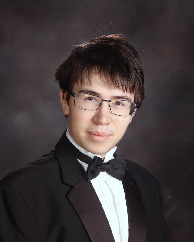 Jayson Viles, Manogues National Merit Semifinalist poses for his senior portrait. Photo courtesy of the Bishop Manogue Yearbook Staff.