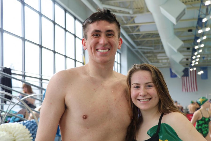 Sam DeRuse and Emilee Bryan smile at a swim meet at Carson Aquatic Center.  Photo courtesy of the Bishop Manogue yearbook staff.