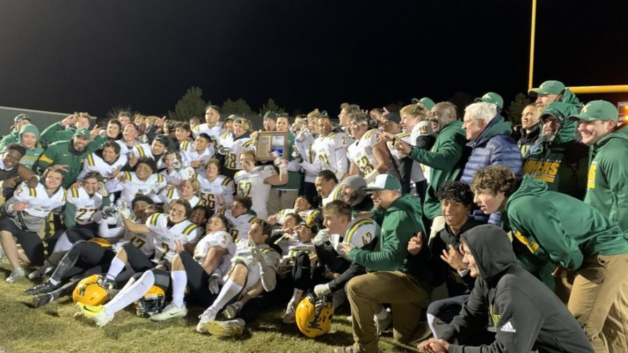 The+2019+varsity+football+team+poses+together+after+winning+the+regional+championship+last+year.+Photo+courtesy+of+Nevada+Sports+Net.